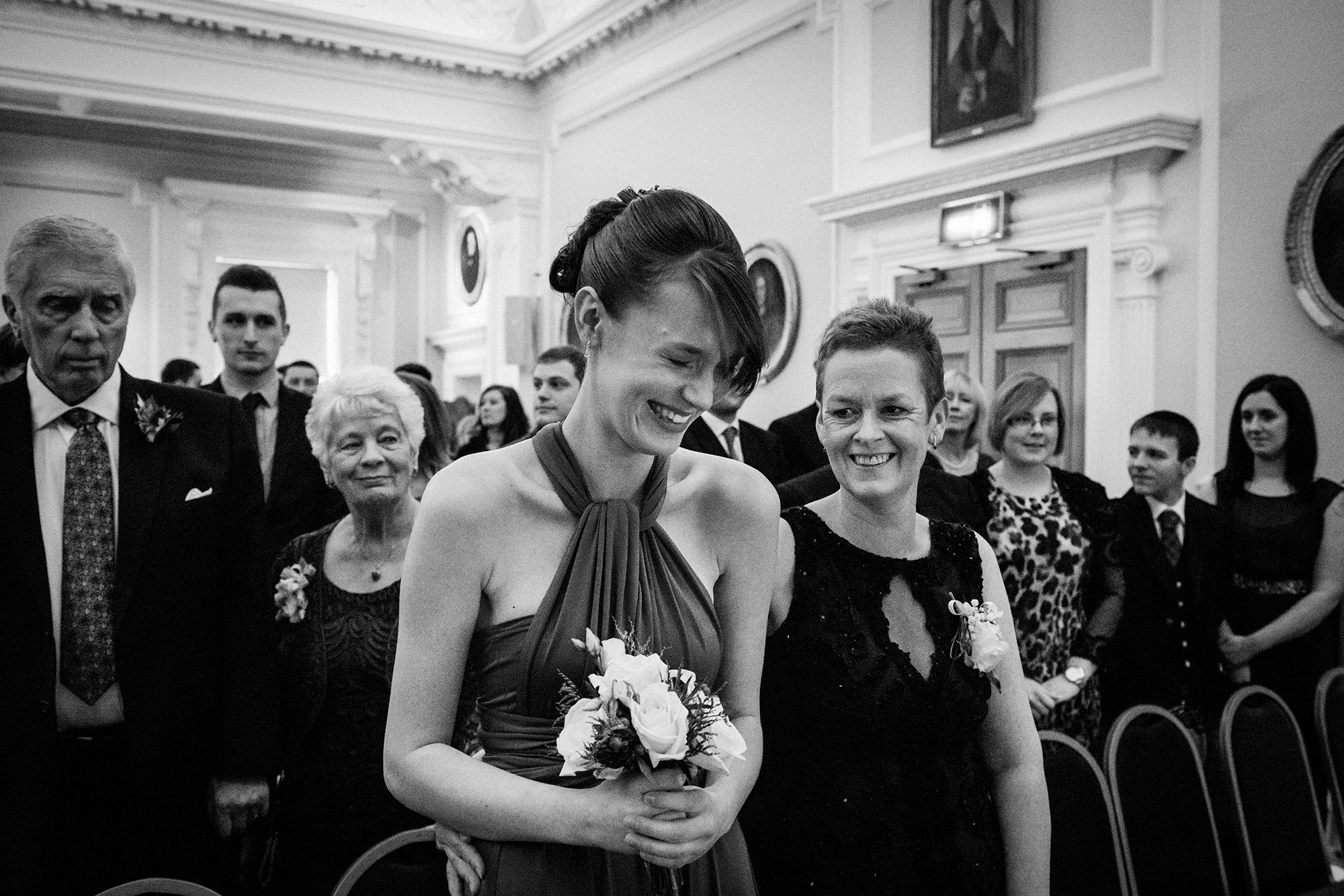 Bridesmaid laughing at Surgeons Hall Edinburgh wedding