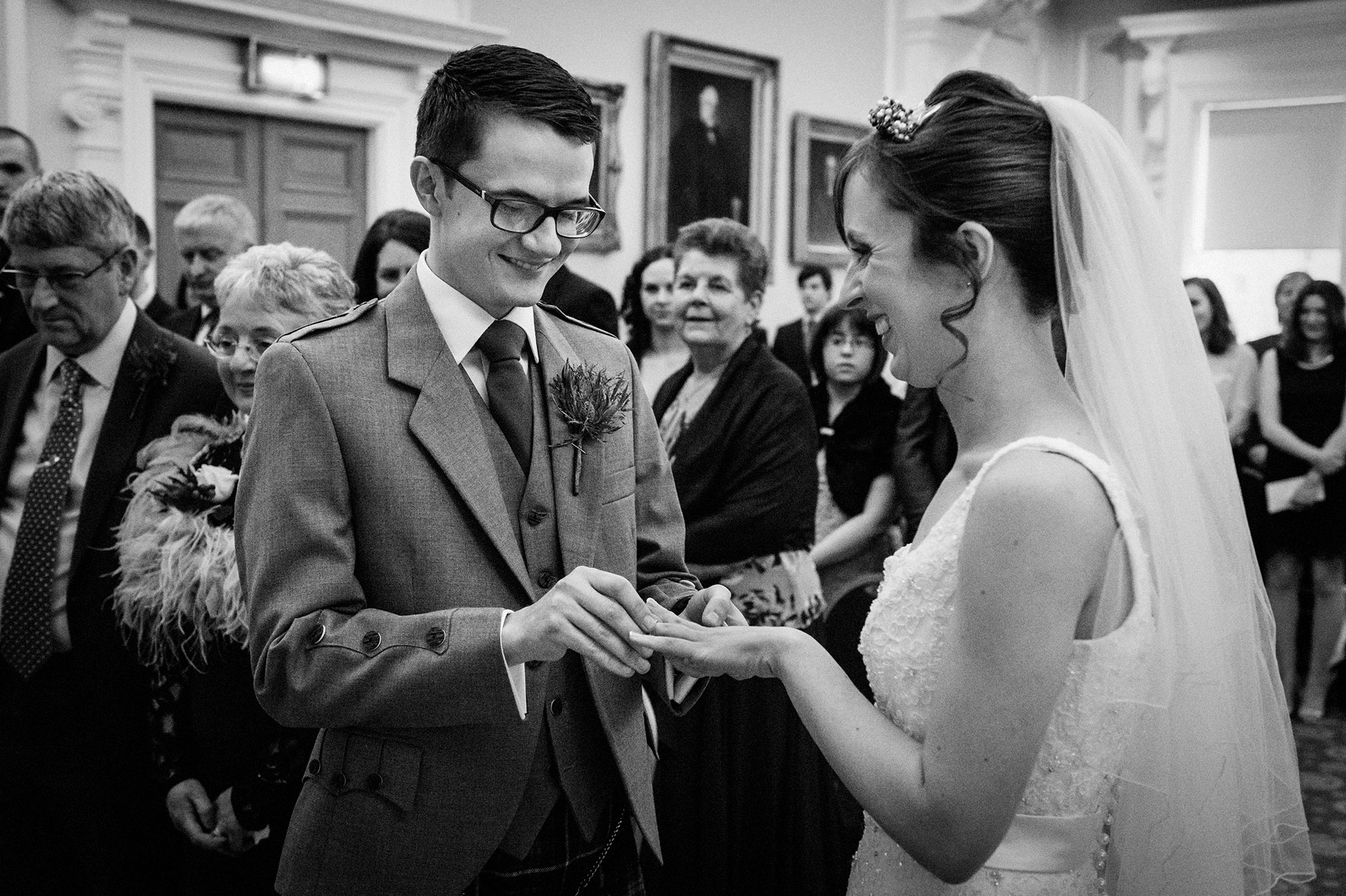 Exchange of wedding rings at Surgeons Hall Edinburgh wedding