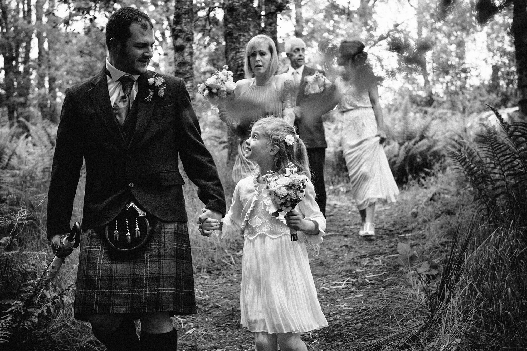Walking through the forest Comrie Croft Perth and Kinross wedding