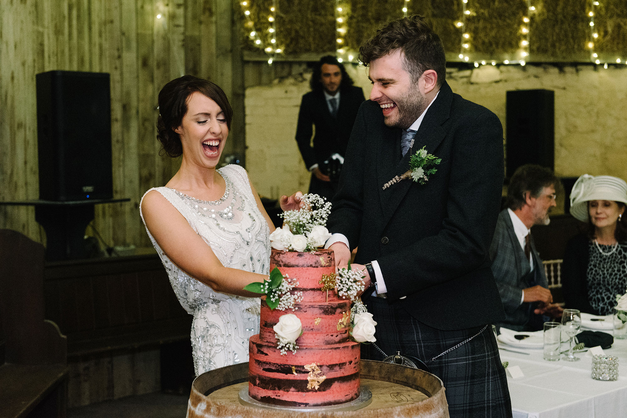 Cutting the cake Comrie Croft Perth and Kinross wedding